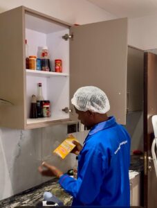 Cockroach Pest Control inspection around kitchen appliances